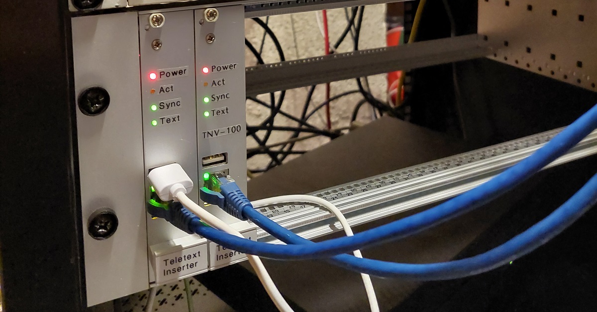 Two aluminium-fronted subrack modules. They each have four LEDs labelled 'power', 'act', 'sync' and 'text', a USB port, and an ethernet port.