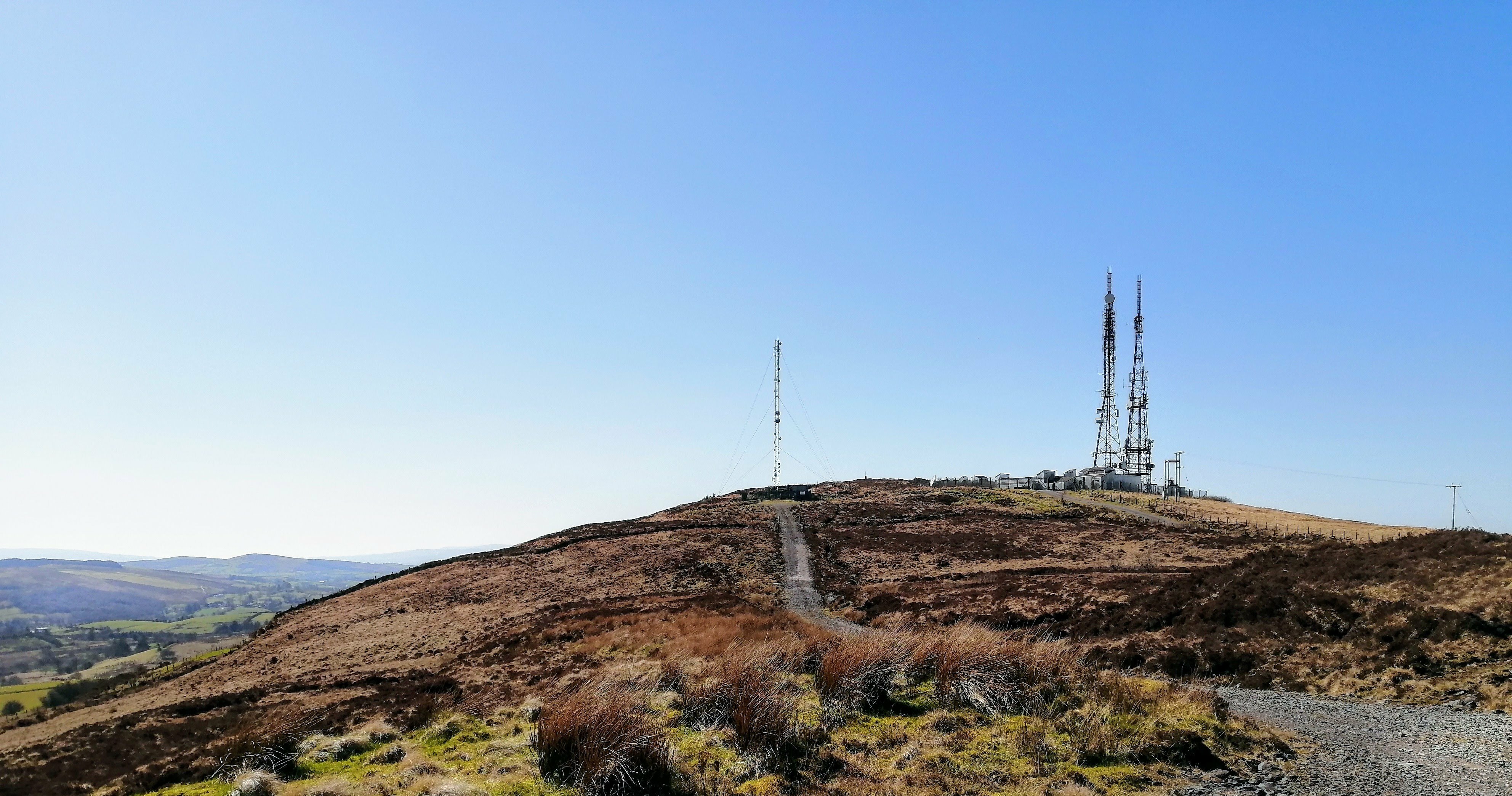 Transmitters at the other side of the mountain, close the the peak. These are a lot more secure than the aforementioned masts, having large metal fences with spiked tops around them.