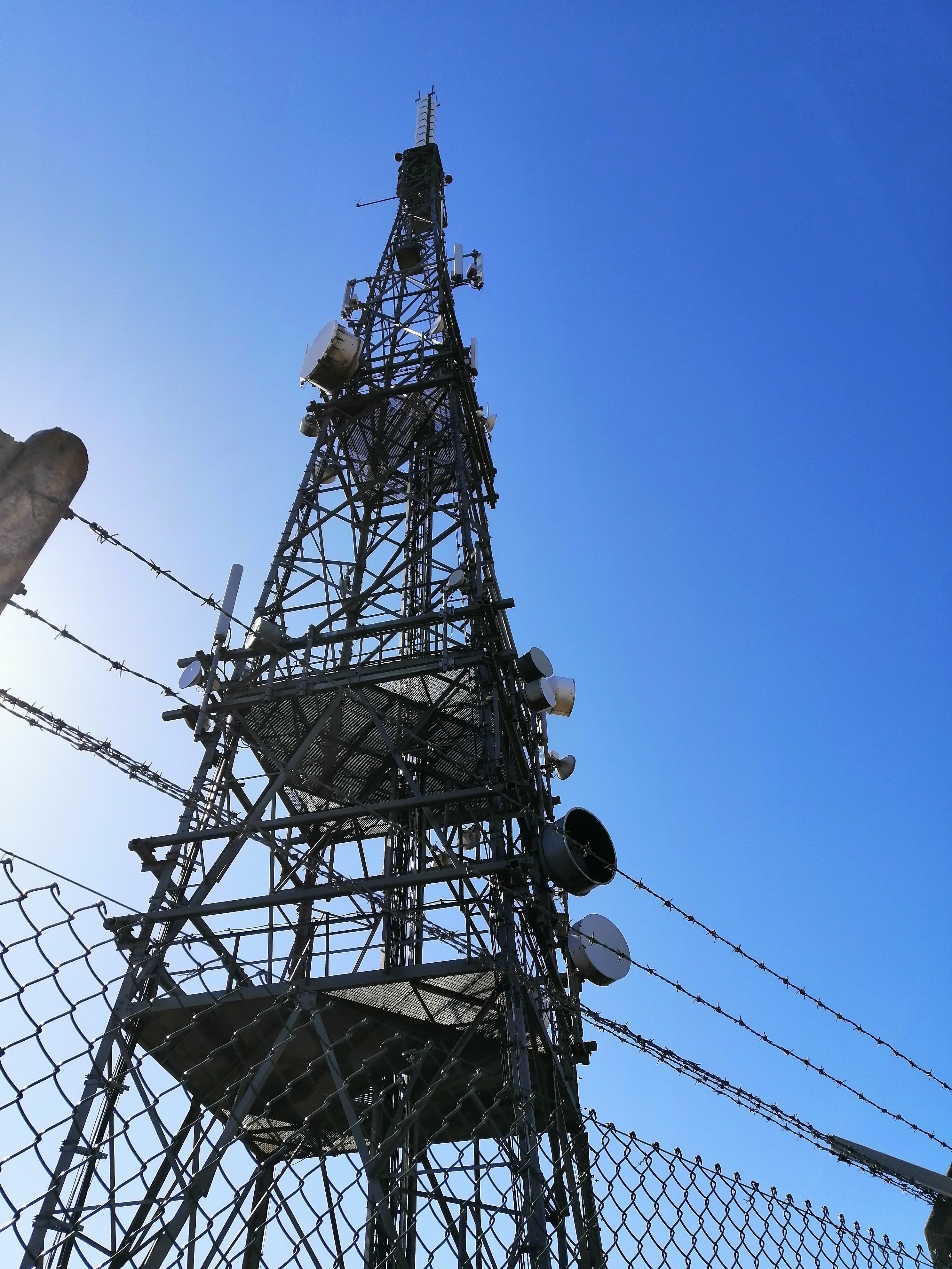 View of the opposite side of Mast B. More of the same, microwave antennas and mobile masts.